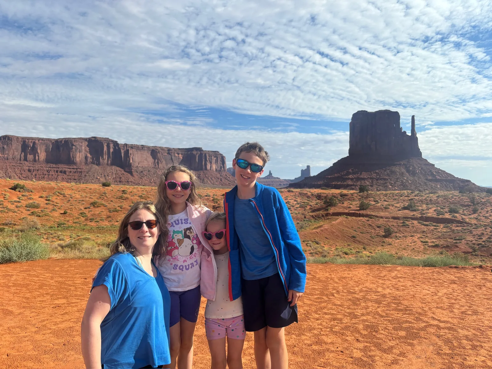 Sunglasses and smiles in front of the Left Mitten.
